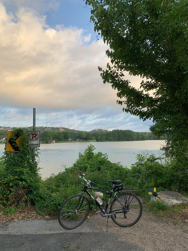 a picture of a river and a bicycle